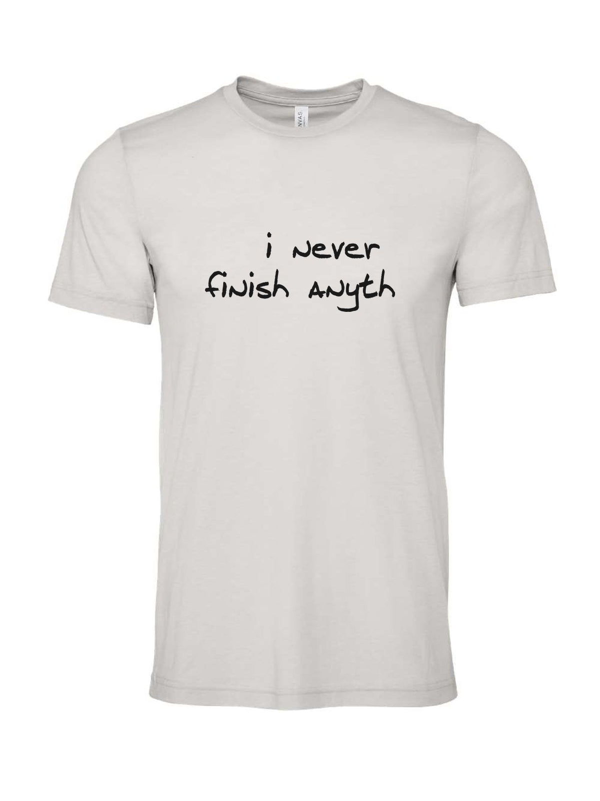 I Never Finish Anyth on a cement gray t-shirt